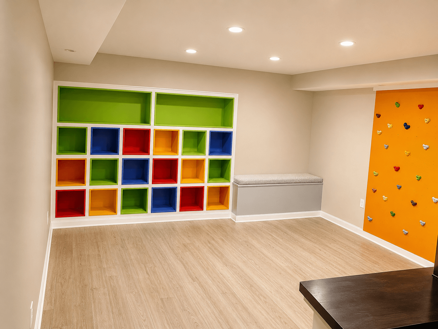 Custom playroom with built-in cubbies and climbing wall